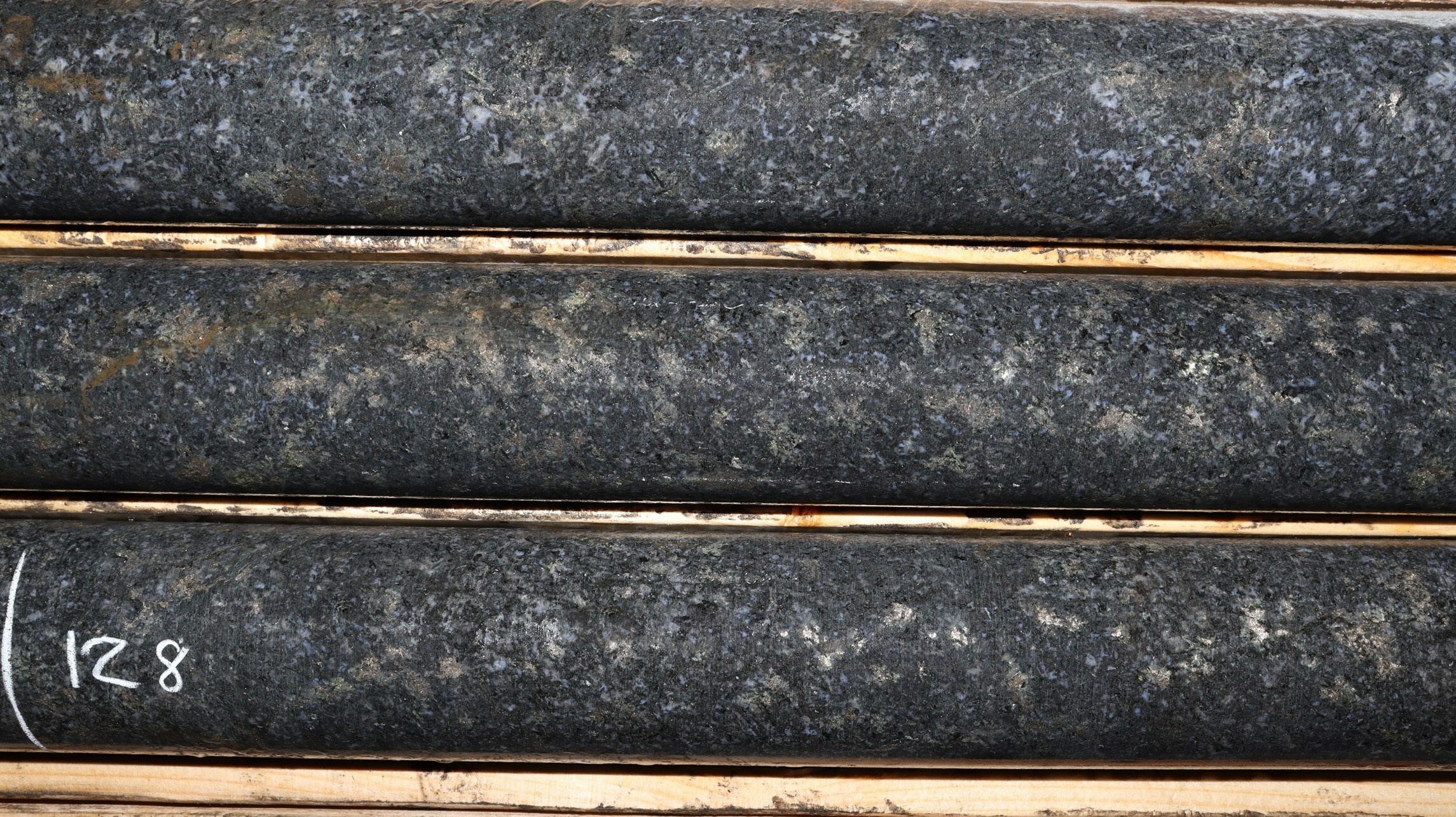 Photo 1: Typical ‘West Graham-style’ mineralization from hole WG-23-026. Core is NQ diameter measuring 47.6 millimetres. Photo is from a depth of 128 metres. (CNW Group/SPC Nickel Corp.) Photo 1: Typical ‘West Graham-style’ mineralization from hole WG-23-026. Core is NQ diameter measuring 47.6 millimetres. Photo is from a depth of 128 metres. (CNW Group/SPC Nickel Corp.)