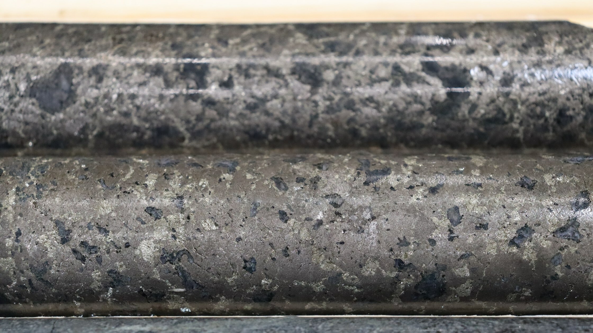 Photo 3: Massive sulphide mineralization from WG-23-026 with visible pentlandite. Core is NQ diameter measuring 47.6 millimetres. Photo is from a depth of 177.5 metres. (CNW Group/SPC Nickel Corp.)