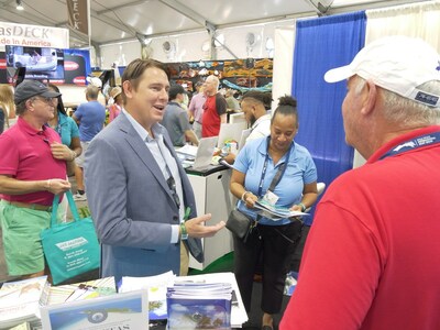 Parliamentary Secretary, Hon. John H. W. Pinder, speaks at The Bahamas’ information desk at the 41st West Palm Beach International Boat Show.