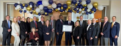 Representatives from the Office of the Comptroller of the Currency (OCC) celebrate Old Point National Bank's 100th anniversary with the company’s board of directors and executives.