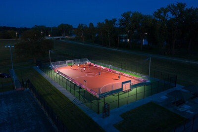 A mini-pitch in use for night time play.