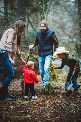 Andrew and Courtney Browne, proprietors of Browne Family Vineyards, plant trees with their children in support of the Browne Forest Project