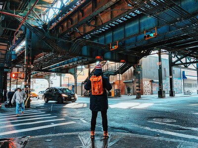 NYC traveler under elevated train