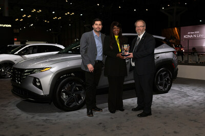 Olabisi Boyle, vice president, product planning and mobility strategy, Hyundai Motor North America accepts the 2023 Best Plug-in Hybrid award from Jim Sharifi, managing editor, autos, U.S. News & World Report and John Vincent, senior automotive correspondent, autos, U.S. News & World Report at the 2023 New York International Auto Show on April 5, 2023.