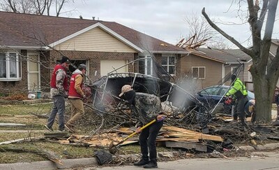 The Lowe's team helped residents clean up debris in Coralville after tornadoes left widespread damage in Eastern Iowa.