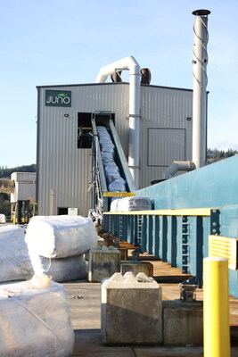 Bales of mixed waste are loaded onto a conveyer belt to be processed by Georgia-Pacific's Juno waste recovery technology in Toledo, Oregon.