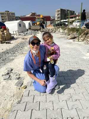 PCOM Georgia medical student Inara Patton (DO '26) bonds with a child in Turkey following the devastating February earthquake.