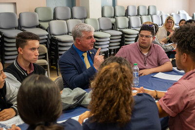 PenFed EVP of Member Operations Jamie Gayton speaks with University Gardens High School students during a speed networking activity.