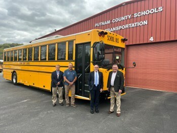 Putnam County Schools taking delivery of a GreenPower BEAST all-electric purpose-built school bus. In the photo are Bruce McGrew, Assistant Superintendent; Pat Clark, Director of Transportation; John Hudson, Superintendent and GreenPower Motor Vice President Mark Nestlen