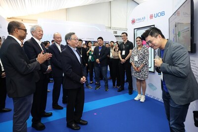 Minister of Trade and Industry Gan Kim Yong (centre) with Senior Minister of State Janil Puthucheary (from left), Senior Minister Teo Chee Hean and Mr Wee Ee Cheong, UOB Deputy Chairman and Chief Executive Officer at UOB’s The FinLab showcase at PDD on 18 April 2023. (Photo courtesy of MCI) (PRNewsfoto/UOB)