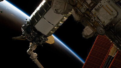 The Northrop Grumman Cygnus space freighter is pictured in the grip of the Canadarm2 robotic arm as ground controllers remotely install the cargo craft to the International Space Station's Unity module. The space station was orbiting into a sunset 257 miles above the Indian Ocean off the coast of the African nation of Tanzania. Credits: NASA