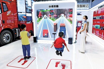 Children experience the motion-sensing parkour game.