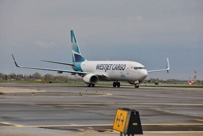 737-800 Boeing Converted Freighter lands (CNW Group/WESTJET, an Alberta Partnership)