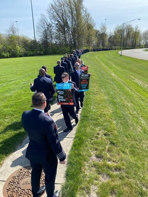 More than 350 pilots, their family members and fellow NetJets peers and Union members represented by Teamsters Local 284 picketed outside Berkshire Hathaway's NetJets on Wednesday, April 19, to draw attention to the brand's decline in status as a choice career opportunity for talented aviators.