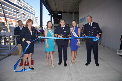 Captain Mark Trembling cuts the ribbon to open Holland America Line's Alaska cruise season with Miss Alaska, Jessica Reisinger, and Miss Washington, Regan Gallo