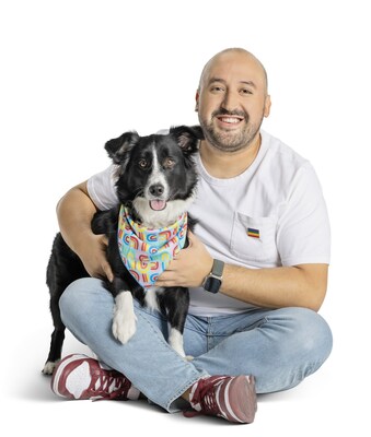 PetSmart associate and their dog display a bandana from the You Are Loved collection, created in partnership with PetSmart's PRIDE AT WORK associate resource group