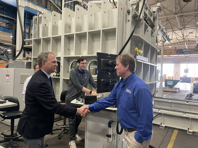 U.S. Representative Sean Casten (Left) shaking the hands with Chief Additive Manufacturing Engineer Scott Stecker (Right)