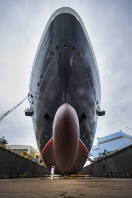 Safety Officer Lucas Wozniak inspects the hull of Queen Anne as the world’s most iconic luxury cruise brand Cunard celebrated a momentous construction milestone today with the float out of their fourth ship at the Fincantieri Marghera shipyard in Venice, Italy. (PRNewsfoto/Cunard)
