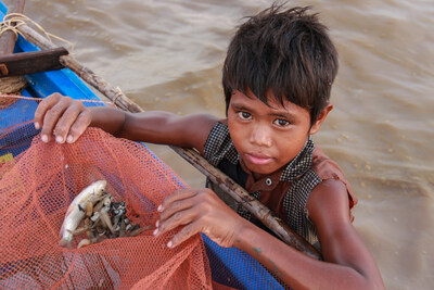 When the weather conditions worsened in Cambodia, Khav was forced to drop out of school and start fishing to earn money. Migrant workers, including children, are held captive by unscrupulous labour brokers. The children are forced to do dangerous work in extremely poor conditions hundreds of miles from land for months at a time. Canada's fish imports were valued at $440.6 million in 2021. (CNW Group/World Vision Canada)