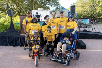 Every year, Walk With Me highlights clients that are thriving thanks to Easter Seals Greater Houston's high-quality, interconnected services. Pictured are the 2023 Walk With Me Ambassadors, Ethan, Ryan, and Duncan, gathered at the stage with their families. Read their stories at WalkWithMeHouston.org.