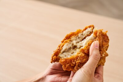 TiNDLE TrueCut™ technology featured in a juicy, golden fried chicken sandwich patty, cut in half