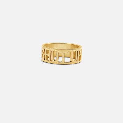 The "Shut Up" ring represents the unapologetic brand identity.