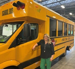 GreenPower’s Sr. Manager of Human Resources Taylor Freeland at the South Charleston,
West Virginia manufacturing facility with the all-electric Type A Nano BEAST school bus.