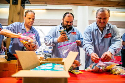 Post Consumer Brands Northfield employees team up to assemble culturally relevant pantry packs for Latino and East African families facing food insecurity in Dakota County at the plant’s “Ingredients for Good” volunteer event. (Credit: Drew Anthony Smith/Post Consumer Brands)