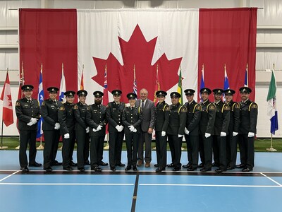 The 14 fishery officer graduates from troop 23-1 with regional Director General Serge Doucet (CNW Group/Fisheries and Oceans (DFO) Canada)