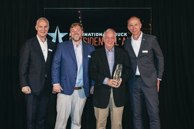 WATERS Group Vaughan Waters (middle left) and David Waters (middle right) accept their International Truck 2022 North American Truck Dealer of the Year award from Navistar President and CEO Mathias Carlbaum (far right) and EVP, Commercial Operations Goran Nyberg (far left) at the annual President's Club meeting in Stockholm, Sweden.