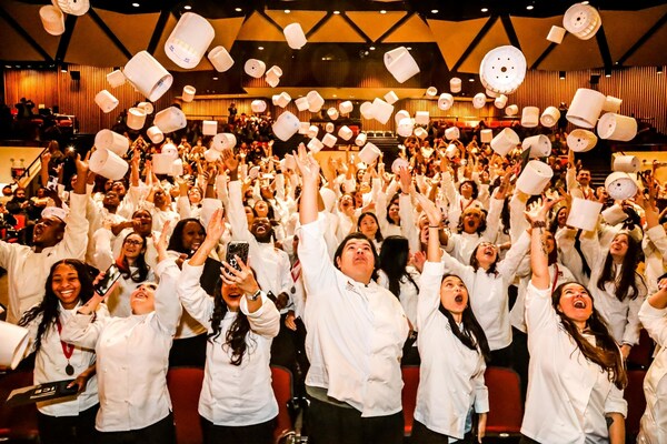 Graduates from the Institute of Culinary Education participate in the ceremonial toque toss during their ceremony. For more visit ice.edu.