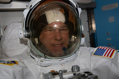 NASA astronaut Steve Bowen prepares for a spacewalk in the International Space Station's Quest airlock during Expedition 69.