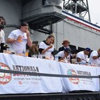 FIFTH-ANNUAL DONUT-EATING CONTEST RAISES MONEY FOR VETS ABOARD USS MIDWAY