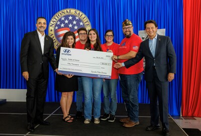 Randy Parker, CEO, Hyundai Motor America, Oswaldo Perez, U.S. Marine Corporal, Diane D. Nemecek, Senior Director, Folds of Honor, José Muñoz, President and Global Chief Operating Officer, Hyundai Motor Company, and President and CEO, Hyundai and Genesis Motor North America pictured with the Perez Marin family, Folds of Honor Scholarship recipients during the check presentation at the U.S. Coast Guard Air Station in Miami on May 26, 2023.