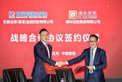The signing of the strategic cooperation agreement between Mr. Hui Liu, Chairman of Soochow Securities (Hong Kong) (Right) and Mr. Andy Chen, Chairman of the Board and Executive Director of DL Holdings (Left)