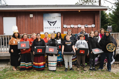 Chief of Acadia First Nation, Deborah Robinson with inaugural recipients of Gratitude Seafood's Laptop for Learners giveback program, recognizing those working to restore traditional Indigenous culture and language. (CNW Group/Gratitude Seafood)