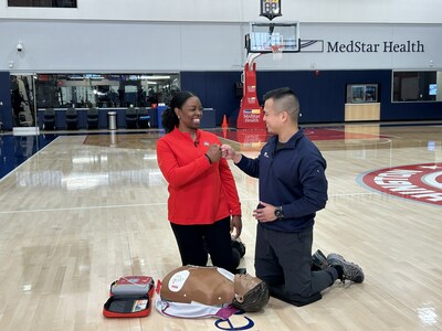 MedStar Health Emergency Physician Alex Koo, MD, and Washington Mystics Head of Rehabilitation Kala Flagg, DPT, ATC, CSCS, demonstrate CPR and AED administration for the new video campaign.