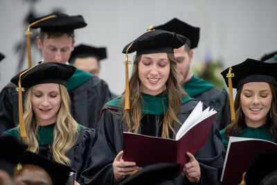 Graduates recite their professional oath during the commencement ceremony.