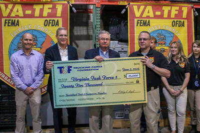 Trucking Cares Foundation Chairman Phil Byrd, with ATA President and CEO Chris Spear and TCF President John Lynch present a check for $25,000 to Battalion Chief Jeff Lewis of Virginia Task Force-1.