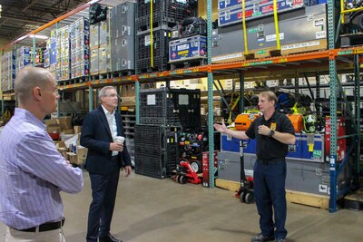 Lt. Bill Lamont, warehouse manager, VA Task Force-1, offers a tour of the group's facility to ATA President Chris Spear and Trucking Cares Foundation President John Lynch following TCF's $25,000 donation to the elite urban search and rescue organization.