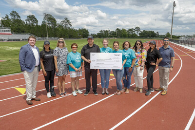 (left to right) Zachary Dykes, project manager, Development Authority of Bryan County, Ciara Calub, corporate social responsibility, Genesis Motor America, Anna Chafin, chief executive officer, Development Authority of Bryan County, Rhonda Brown, coach, Girls on the Run, Brandon Ramirez, director, corporate social responsibility, Genesis Motor America, Blaine Ennis, coach, Girls on the Run, Katherine Ferreira, coach, Girls on the Run, Tiffany Collins, executive director, Girls on the Run, Vanessa Perez, corporate social responsibility, Genesis Motor America in Pembroke, Ga. On June 2, 2023. (Photo/Genesis)