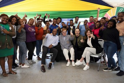 Elton John, David Furnish, Elton John AIDS Foundation CEO Anne Aslett and US Global AIDS Coordinator Dr. John Nkegasong and youth on recent a visit to Johannesburg, South Africa. Courtesy of Chris Bagnall.
