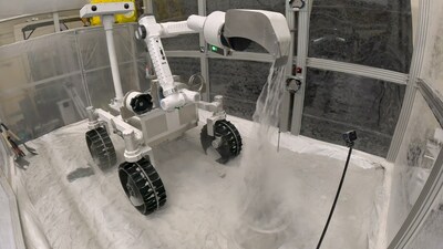 Lunar manipulator and rover in simulated regolith chamber