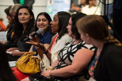 An audience member asks a question at the Engaging Women and Girls in STEM through Data Science event on Wednesday, June 15, 2016, at NASA Headquarters in Washington. The event was held as part of the White House's United State of Women Summit. Credits: NASA/Aubrey Gemignani