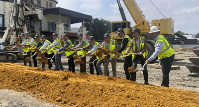 Cosm, Grandscape, and RO leadership officially move the dirt, symbolizing the start of the project.