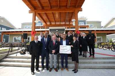 Staff of The Salvation Army and speakers celebrate the announcement of more than $38 million in funding for 175 homes and beds at Grace Village. (CNW Group/Government of Canada)