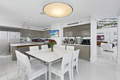 The penthouse's kitchen is sleek and modern yet can accommodate the most ambitious chef. MiamiLuxuryAuction.com.