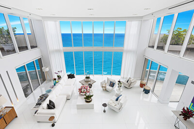 The grand salon is the centerpiece of the penthouse, with soaring ceilings and walls of glass emphasizing the grand vistas of the sparkling ocean. The residence is a true penthouse, occupying the uppermost two levels of the building. More at MiamiLuxuryAuction.com.