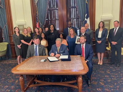 Governor Abbott signing Alyssa's Law alongside Dr. Ilan and Lori Alhadeff, the parents of Alyssa Alhadeff.