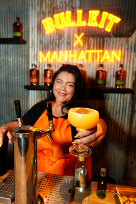 Genesis Cruz mixes cocktails at  The New New York event by Bulleit Frontier Whiskey